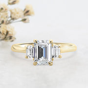 Noah James Jewellers Manchester Engagement Ring Camille Emerald Cut and Trapezoid Cut 3 Stone Engagement Ring Yellow Gold Lab Grown Diamond Moissanite
