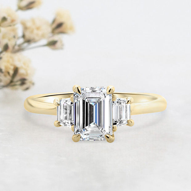 Noah James Jewellers Manchester Engagement Ring Camille Emerald Cut and Trapezoid Cut 3 Stone Engagement Ring Yellow Gold Lab Grown Diamond Moissanite