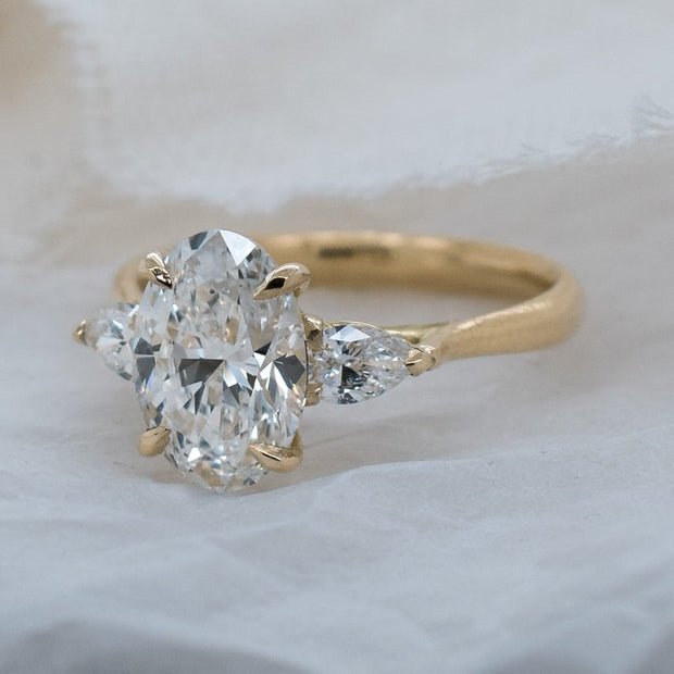 Noah James Jewellers Manchester In Stock Engagement Ring Flora Oval and Pear Shaped 3 Stone Lab Grown Diamond Engagement Ring 2ct Yellow Gold Lab Grown Diamond Moissanite
