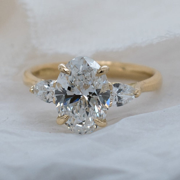 Noah James Jewellers Manchester In Stock Engagement Ring Flora Oval and Pear Shaped 3 Stone Lab Grown Diamond Engagement Ring 2ct Yellow Gold Lab Grown Diamond Moissanite