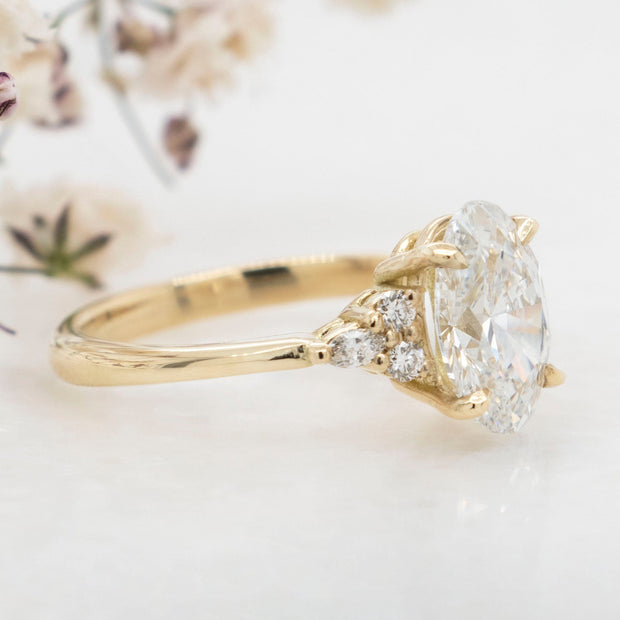 Noah James Jewellers Manchester In Stock Engagement Ring Freya Oval Cut Lab Grown Diamond Solitaire Engagement Ring With Fancy Trefoil Shoulders 1.50ct Yellow Gold Lab Grown Diamond Moissanite