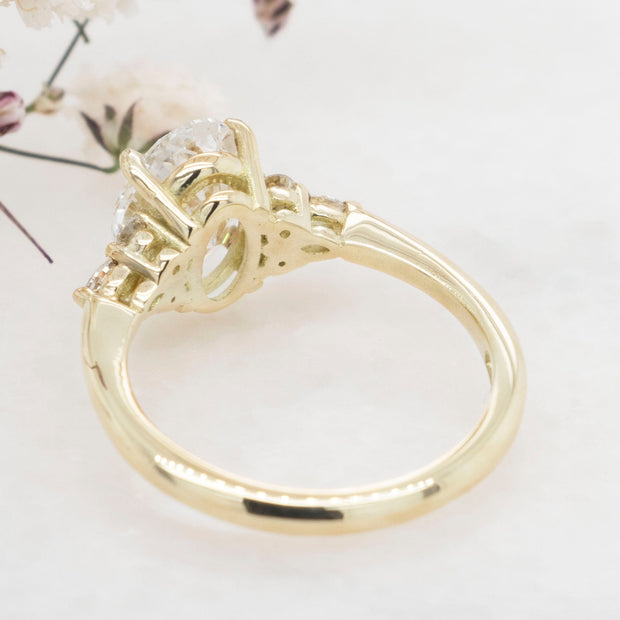 Noah James Jewellers Manchester In Stock Engagement Ring Freya Oval Cut Lab Grown Diamond Solitaire Engagement Ring With Fancy Trefoil Shoulders 1.50ct Yellow Gold Lab Grown Diamond Moissanite