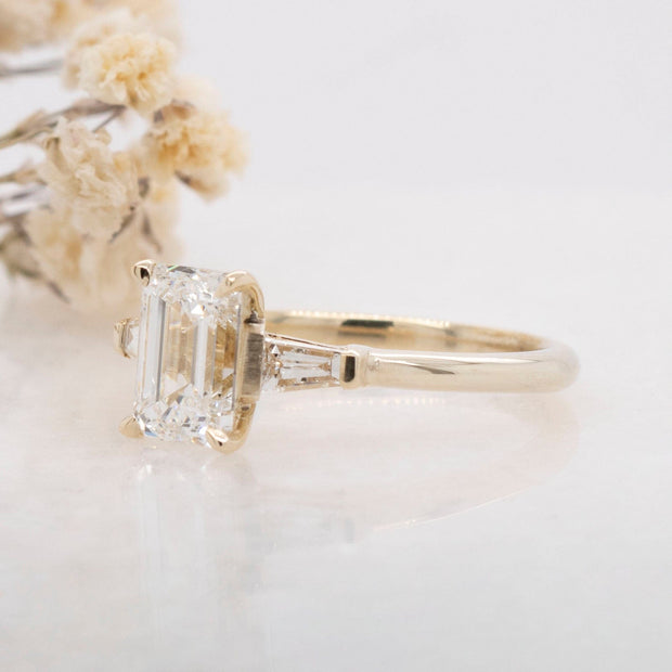 Noah James Jewellers Manchester In Stock Engagement Ring Iris Emerald Cut and Tapered Baguette 3 Stone Lab Grown Diamond Engagement Ring 18ct Yellow Gold 1.50ct Lab Grown Diamond Moissanite