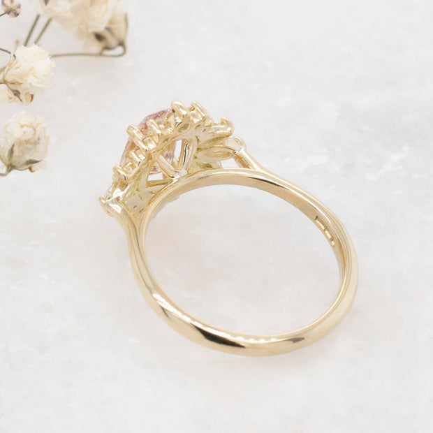 Noah James Jewellers Manchester In Stock Engagement Ring Luella Oval Cut Peachy Pink Lab Grown Diamond Engagement Ring with fancy cluster halo 18ct yellow gold 1.30ct Lab Grown Diamond Moissanite