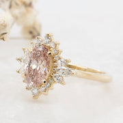 Noah James Jewellers Manchester In Stock Engagement Ring Luella Oval Cut Peachy Pink Lab Grown Diamond Engagement Ring with fancy cluster halo 18ct yellow gold 1.30ct Lab Grown Diamond Moissanite