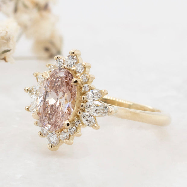 Noah James Jewellers Manchester In Stock Engagement Ring Luella Oval Cut Peachy Pink Lab Grown Diamond Engagement Ring with fancy cluster halo 18ct yellow gold 1.30ct Lab Grown Diamond Moissanite