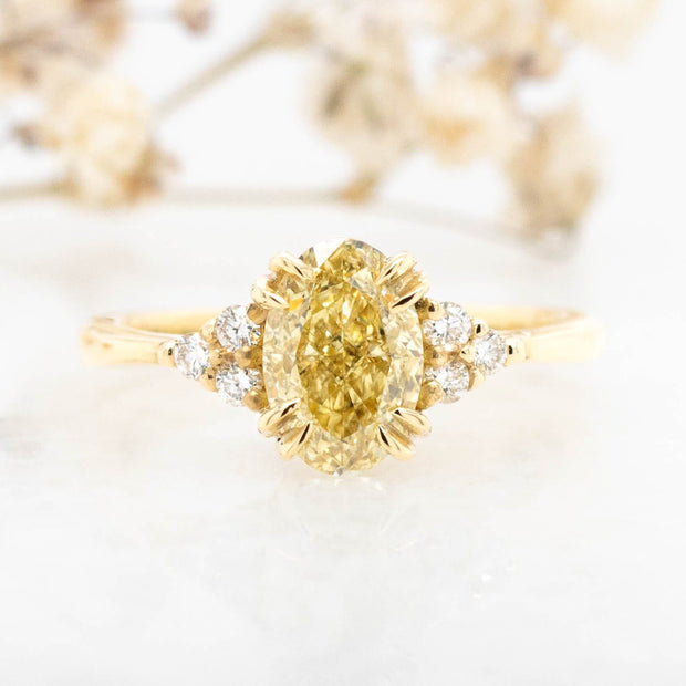Noah James Jewellers Manchester In Stock Engagement Ring Margot Oval Cut Yellow Lab Grown Diamond Engagement Ring With Trefoil Shoulders 18ct yellow gold 1.50ct Lab Grown Diamond Moissanite