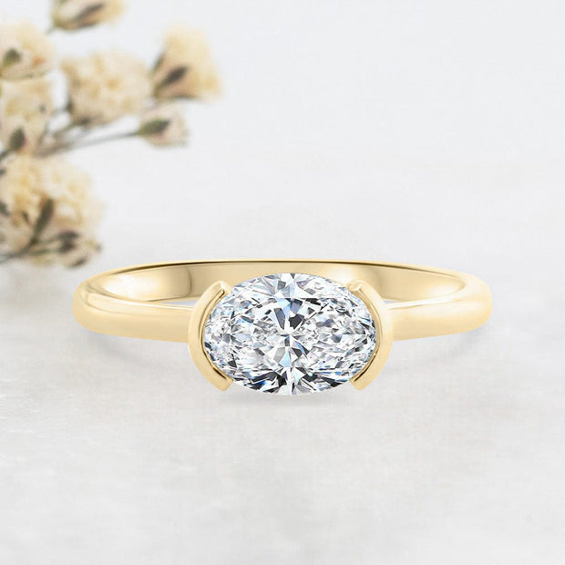 Noah James Jewellers Manchester Engagement Ring Paloma Oval Cut Half Bezel Set Solitaire Engagement Ring Yellow Gold Lab Grown Diamond Moissanite