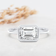 Noah James Jewellers Manchester Engagement Ring Rosa Emerald Cut East West Rubover Solitaire Engagement Ring Platinum Lab Grown Diamond Moissanite