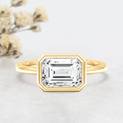 Noah James Jewellers Manchester Engagement Ring Rosa Emerald Cut East West Rubover Solitaire Engagement Ring Yellow Gold Lab Grown Diamond Moissanite