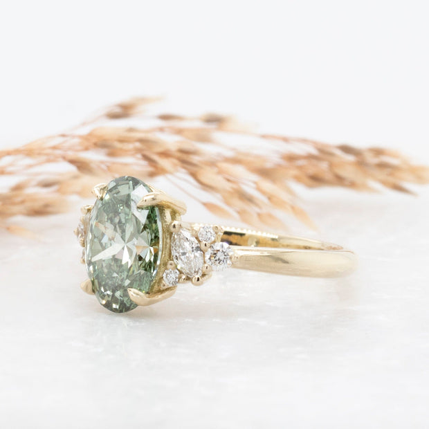 Noah James Jewellers Manchester In Stock Engagement Ring Selena Oval Cut Green Lab Grown Diamond Engagement Ring with fancy cluster shoulders 18ct yellow gold 2.00ct Lab Grown Diamond Moissanite