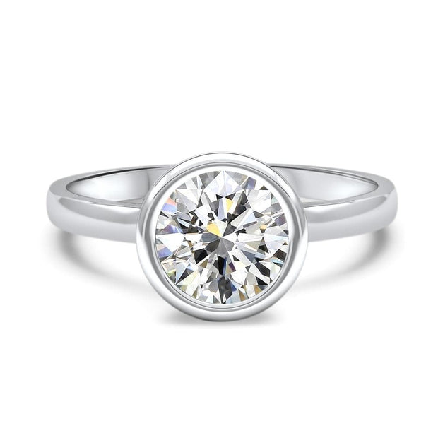 Alyssa Round Brilliant Cut Rubover Solitaire Engagement Ring Platinum | Noah James Jewellery.
