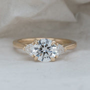 Aquila Round Brilliant and Trilliant Cut Engagement Ring Platinum | Noah James Jewellery.