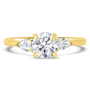 Flora Round Brilliant Cut and Pear Shape Engagement Ring Yellow Gold | Noah James Jewellery.