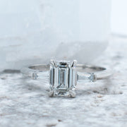 Iris Emerald Cut and Tapered Baguette Engagement Ring Yellow Gold | Noah James Jewellery.