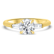 Iris Round Brilliant Cut and Tapered Baguette Engagement Ring Yellow Gold | Noah James Jewellery.