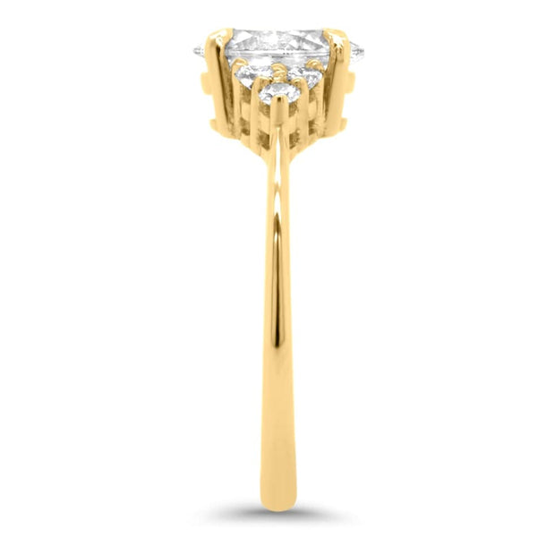 Margot Oval and Round Brilliant Cut Trefoil Shoulder Engagement Ring Yellow Gold | Noah James Jewellery.