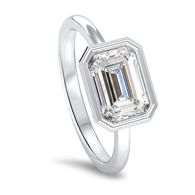 Rosa Emerald Cut East West Rubover Solitaire Engagement Ring Platinum | Noah James Jewellery.