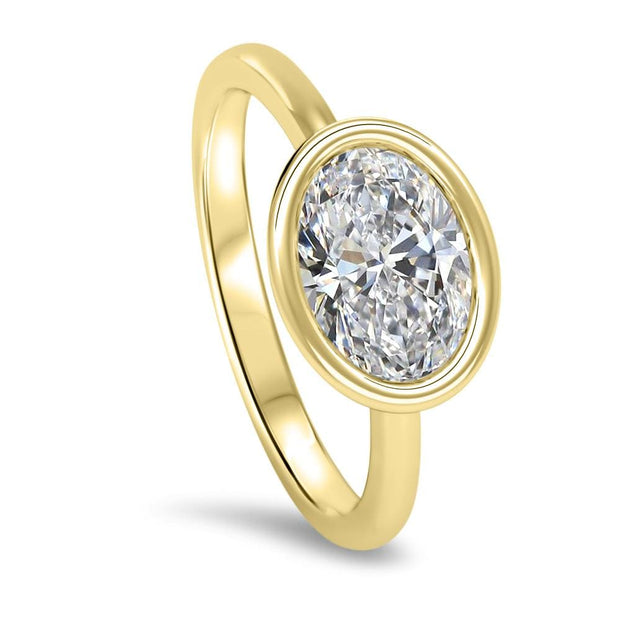 Rosa Oval Cut East West Rubover Solitaire Engagement Ring Yellow Gold | Noah James Jewellery.