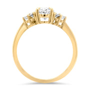 Margot Oval and Round Brilliant Cut Trefoil Shoulder Engagement Ring Yellow Gold | Noah James Jewellery.