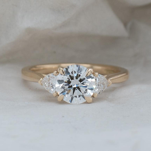 Aquila Round Brilliant and Trilliant Cut 3 Stone Lab Grown Diamond Engagement Ring | Noah James Jewellery.