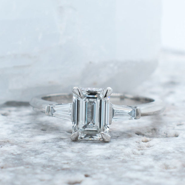 Iris Emerald Cut and Tapered Baguette 3 Stone Lab Grown Diamond Engagement Ring | Noah James Jewellery.
